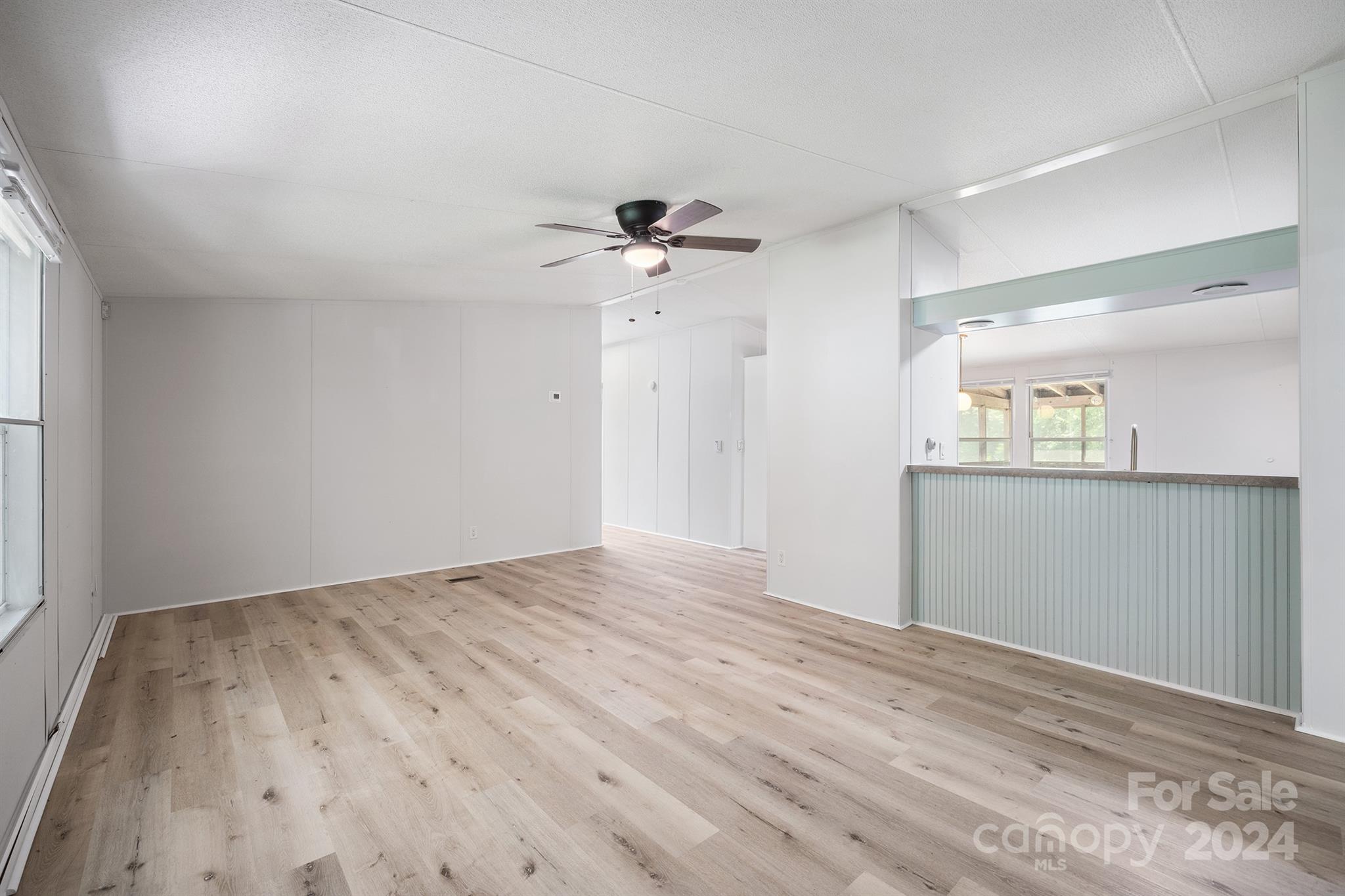 3616 East Brief Road Monroe, NC 28110 - Photo 10 of 30 wooden floor in an empty room with a window