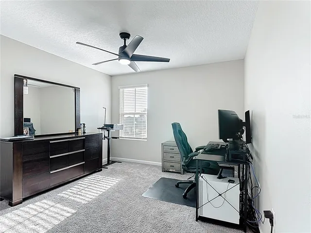 a workspace with furniture and window