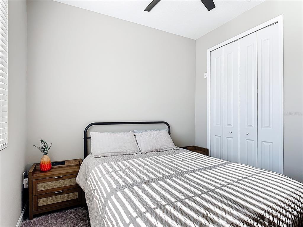 620 Grasshopper Ct Street St. Cloud, FL 34772 - Photo 19 of 29 a bedroom with a bed and a window