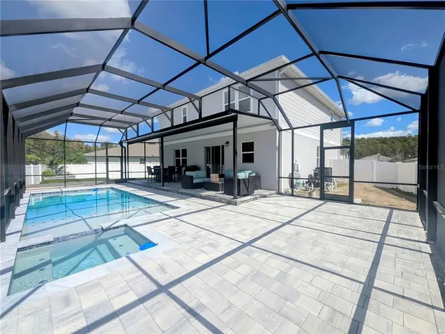 a sitting area with glass door