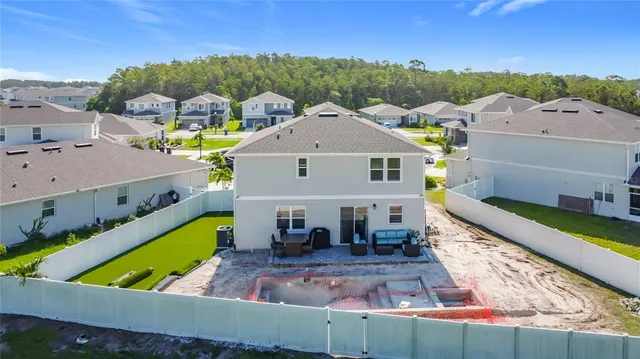 an aerial view of a house with a garden