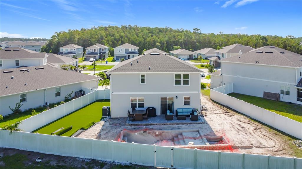 620 Grasshopper Ct Street St. Cloud, FL 34772 - Photo 26 of 29 an aerial view of a house with swimming pool