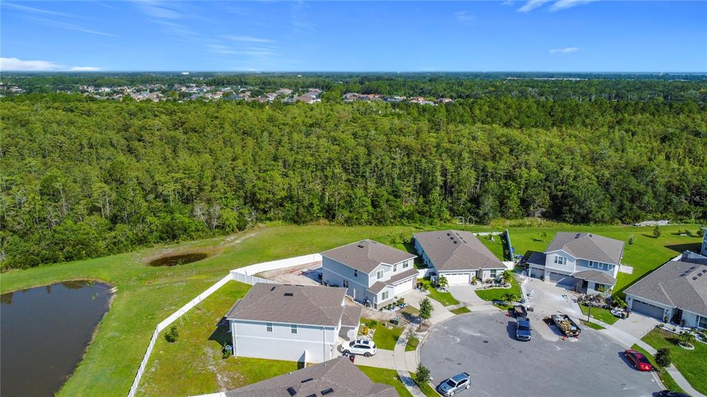 620 Grasshopper Ct Street St. Cloud, FL 34772 - Photo 27 of 29 an aerial view of a house with a garden