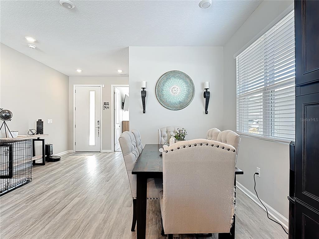 620 Grasshopper Ct Street St. Cloud, FL 34772 - Photo 5 of 29 a living room with furniture and a wooden floor