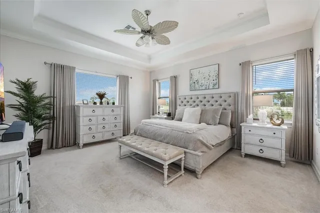 a bed room with a bed and a chair