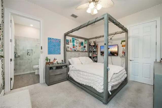 a bed room with a bed and a mirror