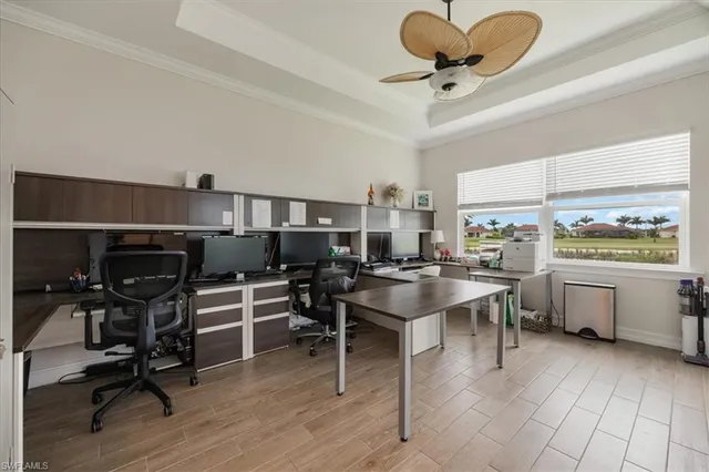 a view of a workspace with furniture and a kitchen