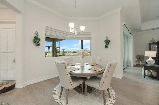 a dining room with furniture and window