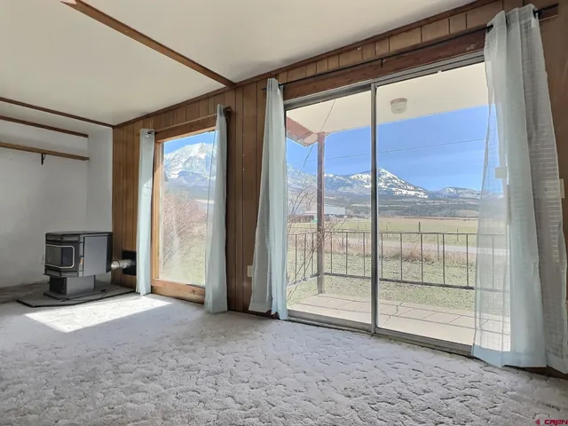 a view of hallway with furniture