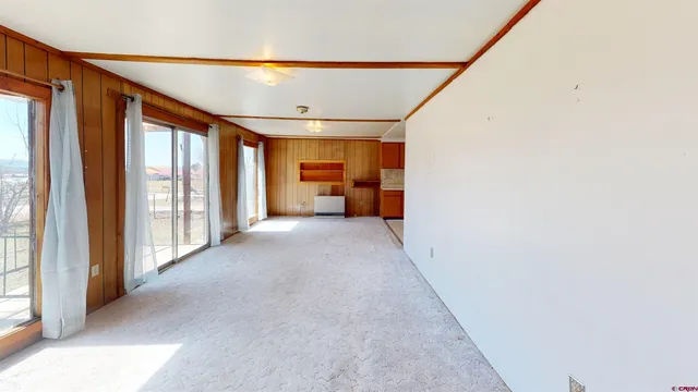 a view of an empty room with a window