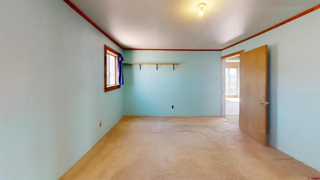 a view of an empty room with a fireplace