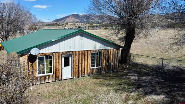 a house with trees in the background