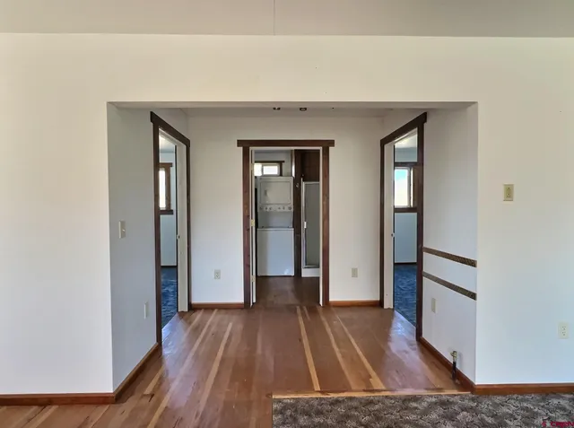 wooden floor in a hall with an entryway
