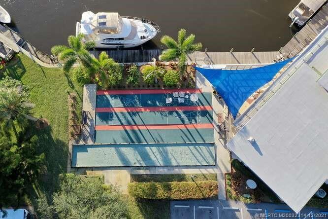 1950 Southwest Palm City Road, Unit 13303 Stuart, FL 34994 - Photo 31 of 34 Waterfront shuffle board.