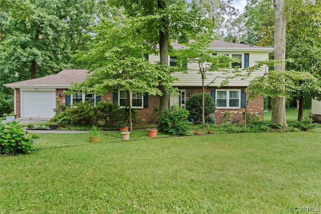 4005 Hidden Valley Road Chester, VA 23831 - Photo 1 of 43 a front view of a house with a yard and trees