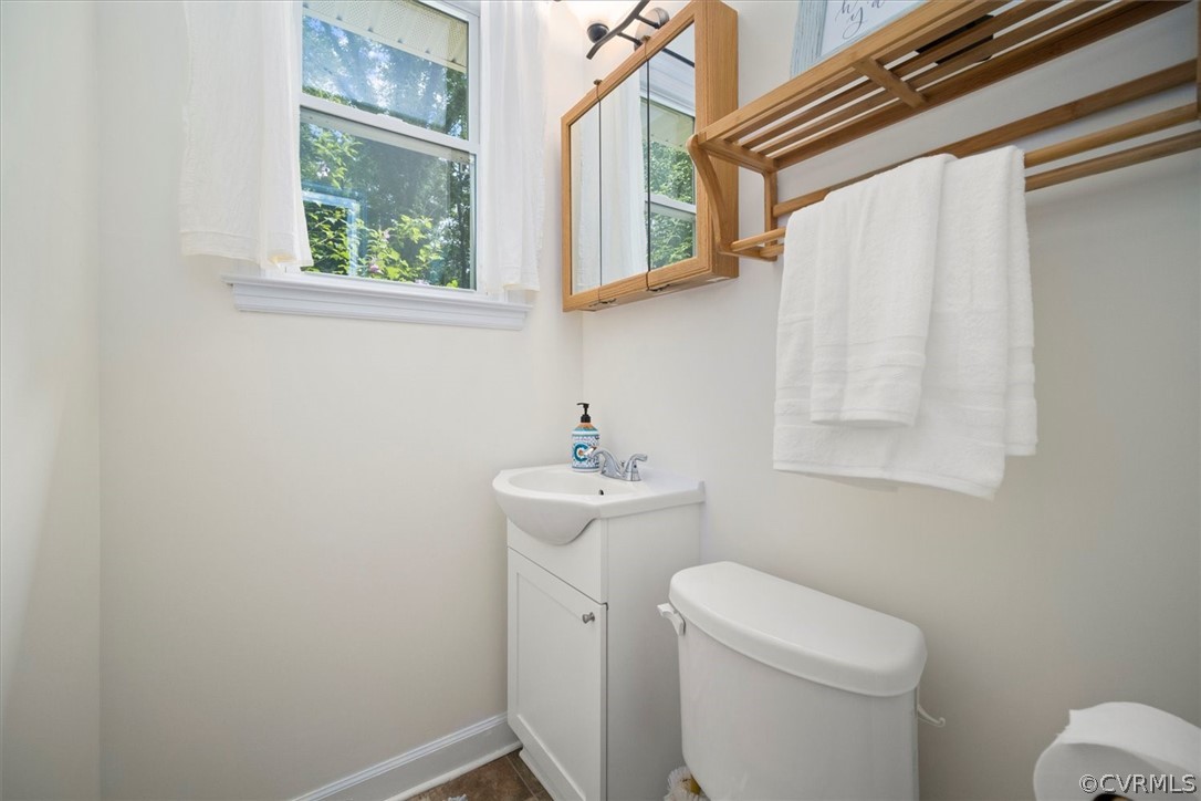 4005 Hidden Valley Road Chester, VA 23831 - Photo 16 of 43 a bathroom with a sink toilet and a mirror
