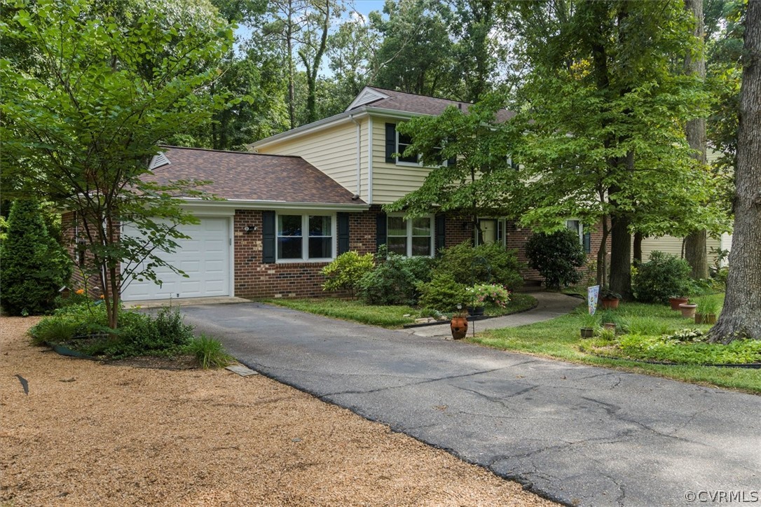 4005 Hidden Valley Road Chester, VA 23831 - Photo 2 of 43 a front view of a house with a yard and trees
