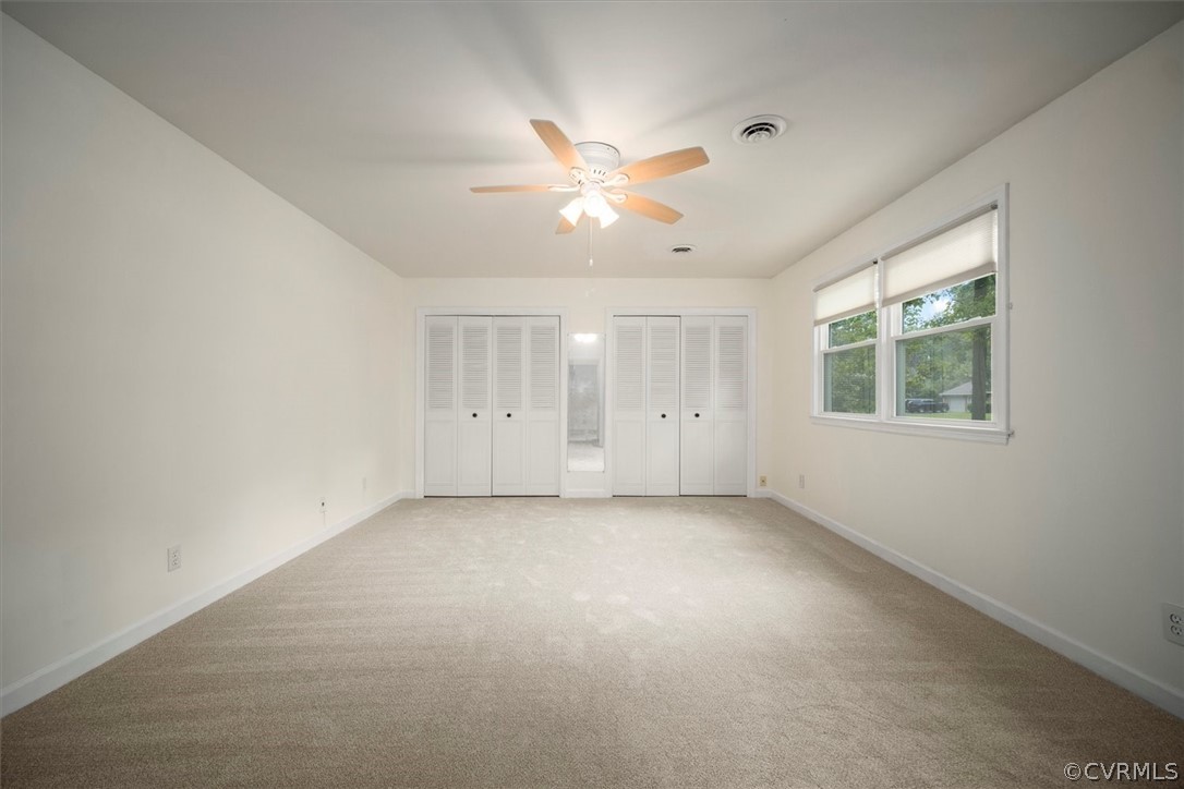 4005 Hidden Valley Road Chester, VA 23831 - Photo 22 of 43 an empty room with a window and a fan