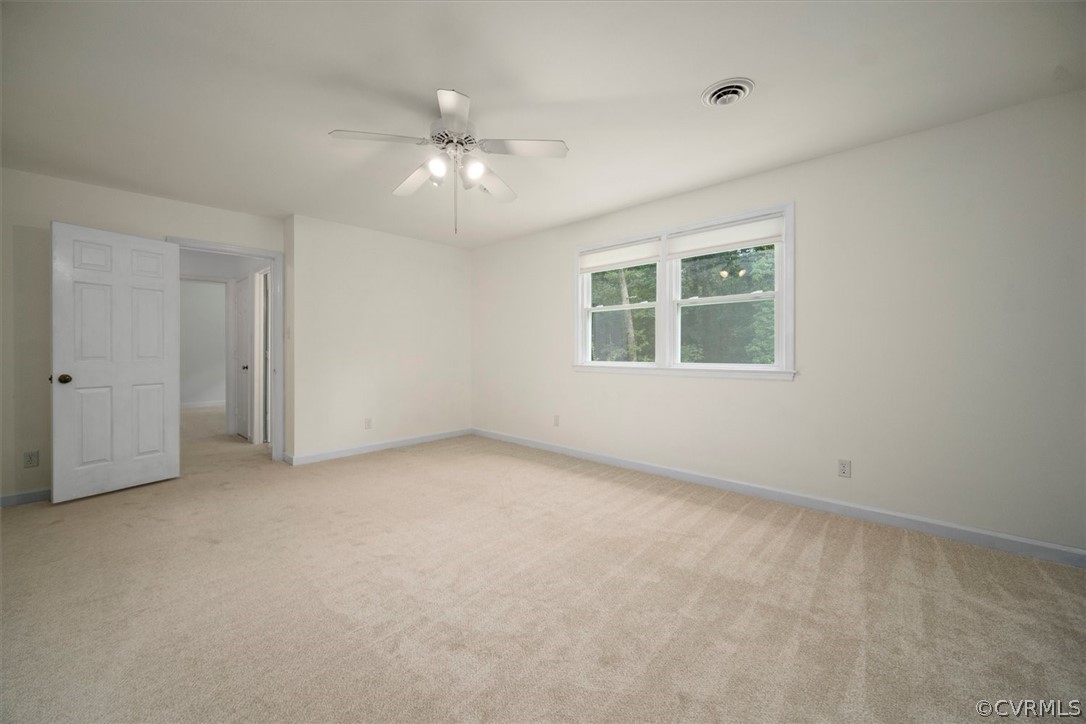 4005 Hidden Valley Road Chester, VA 23831 - Photo 27 of 43 an empty room with windows and fan