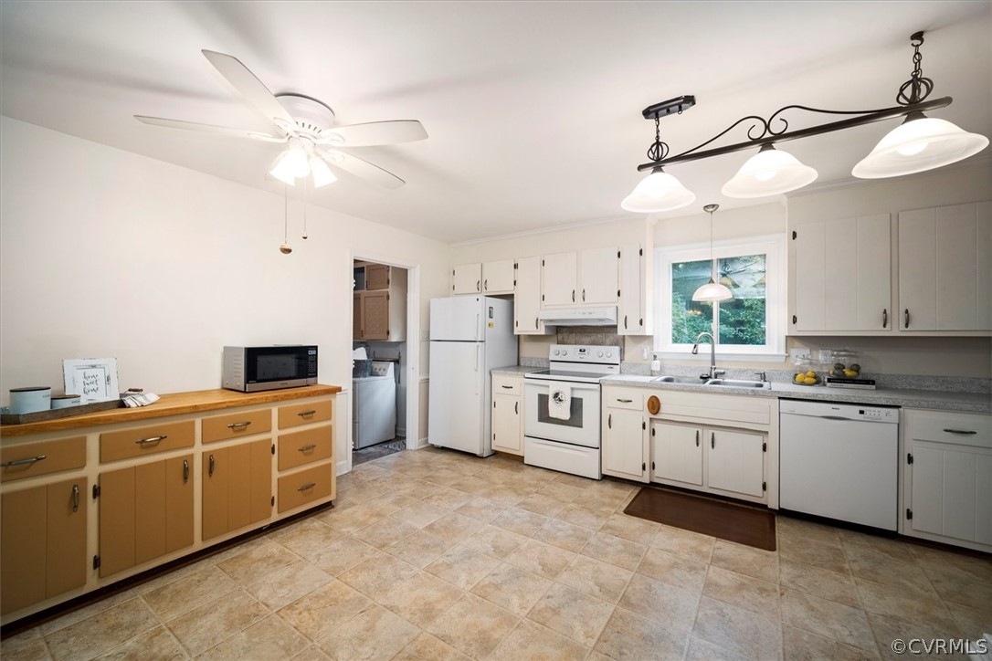4005 Hidden Valley Road Chester, VA 23831 - Photo 8 of 43 a kitchen with white cabinets and white appliances