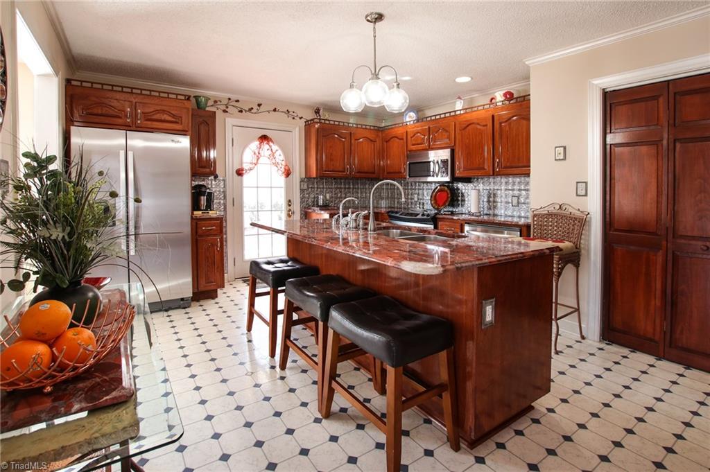 516 Shoreline Road New London, NC 28127 - Photo 12 of 26 Kitchen with stainless steel appliances remaining