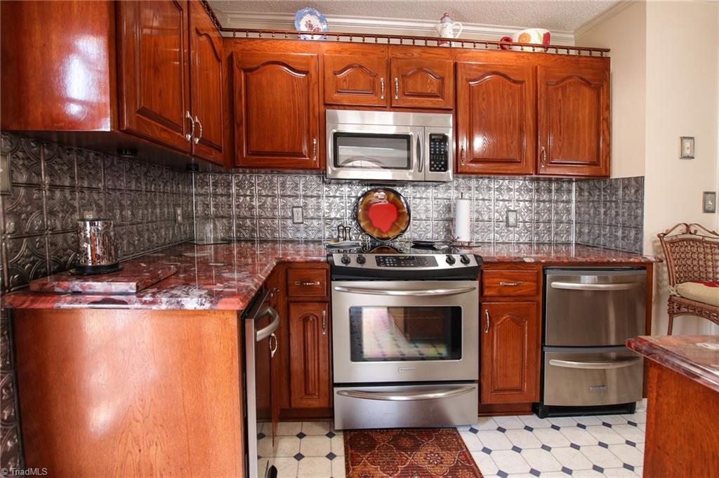516 Shoreline Road New London, NC 28127 - Photo 13 of 26 Stone countertops and custom backsplash