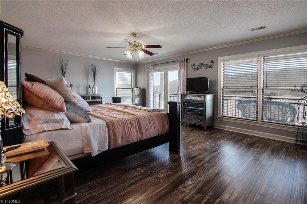 516 Shoreline Road New London, NC 28127 - Photo 17 of 26 Master bedroom has own veranda overlooking lake