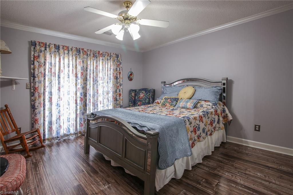 516 Shoreline Road New London, NC 28127 - Photo 22 of 26 2nd bedroom with veranda overlooking lake