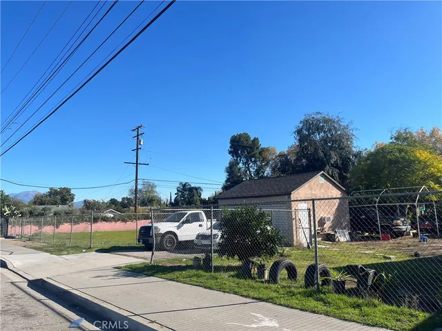 a view of a table and chairs under an umbrella