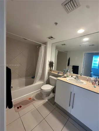 a view of a bathroom with a sink and mirror