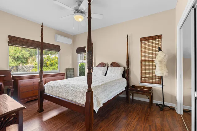 a bedroom with a bed and a table