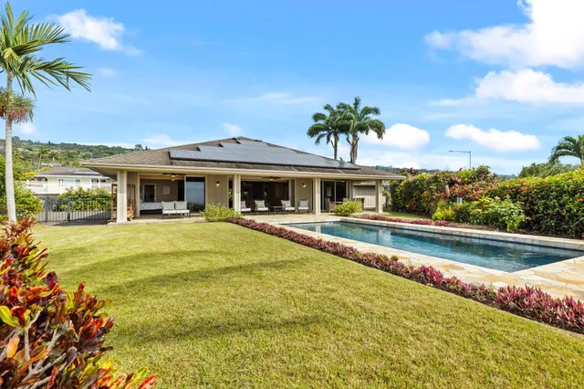 a front view of a house with swimming pool