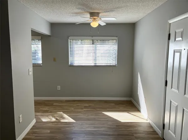 a kitchen with a refrigerator sink and cabinets