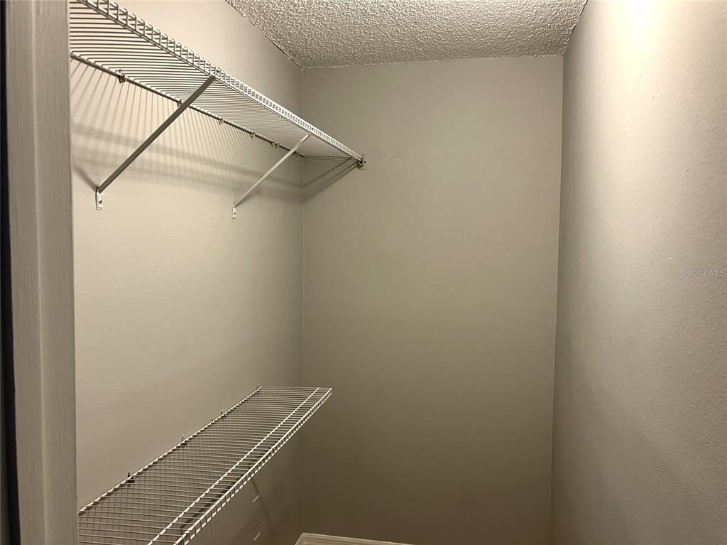 11703 Raintree Village Boulevard, Unit B Temple Terrace, FL 33617 - Photo 32 of 60 a view of a room with rack on the wall