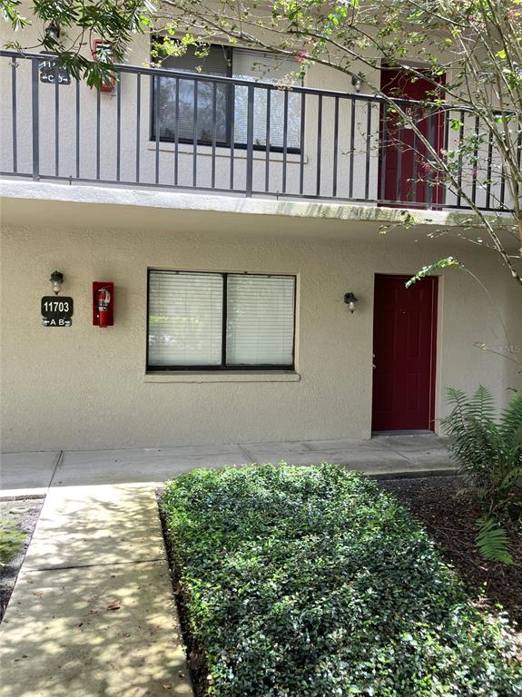 11703 Raintree Village Boulevard, Unit B Temple Terrace, FL 33617 - Photo 5 of 60 a backyard of a house