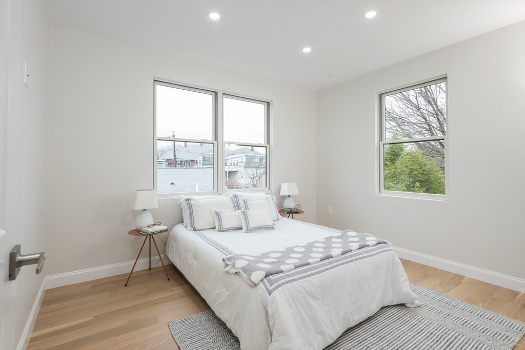 6 Gordon Road Arlington, MA 02474 - Photo 23 of 40 a large bedroom with a bed and a window