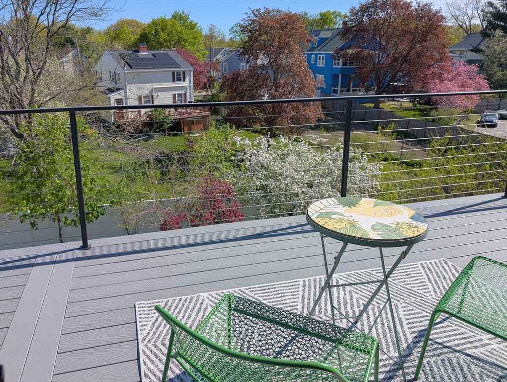 6 Gordon Road Arlington, MA 02474 - Photo 30 of 40 a view of a chairs and table in the balcony