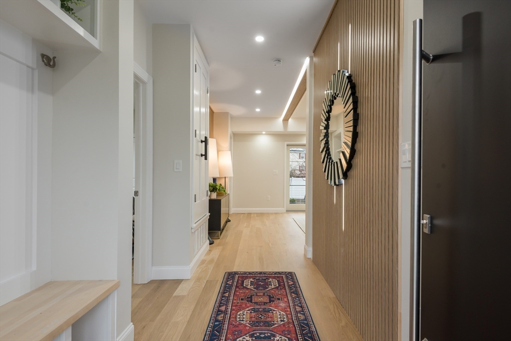 6 Gordon Road Arlington, MA 02474 - Photo 38 of 40 a view of hallway with wooden floor