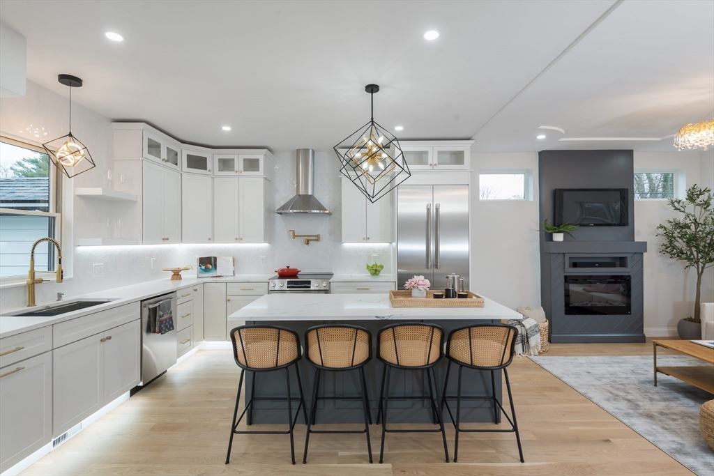 6 Gordon Road Arlington, MA 02474 - Photo 4 of 40 a kitchen with a table and chairs in it
