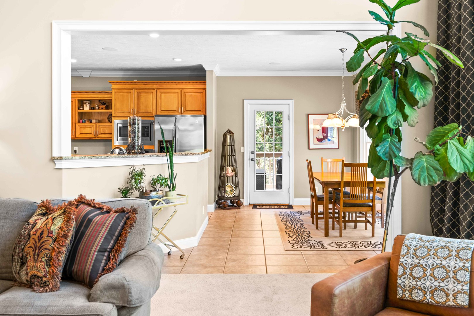 4 Derby Way Bloomington, IL 61704 - Photo 12 of 56 a living room with furniture plant and a large window