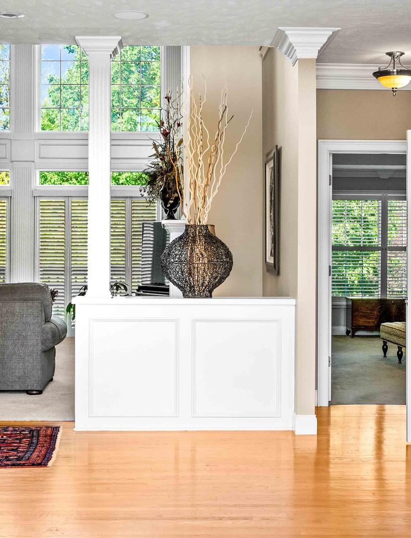4 Derby Way Bloomington, IL 61704 - Photo 13 of 56 a view of living room filled with furniture and large windows