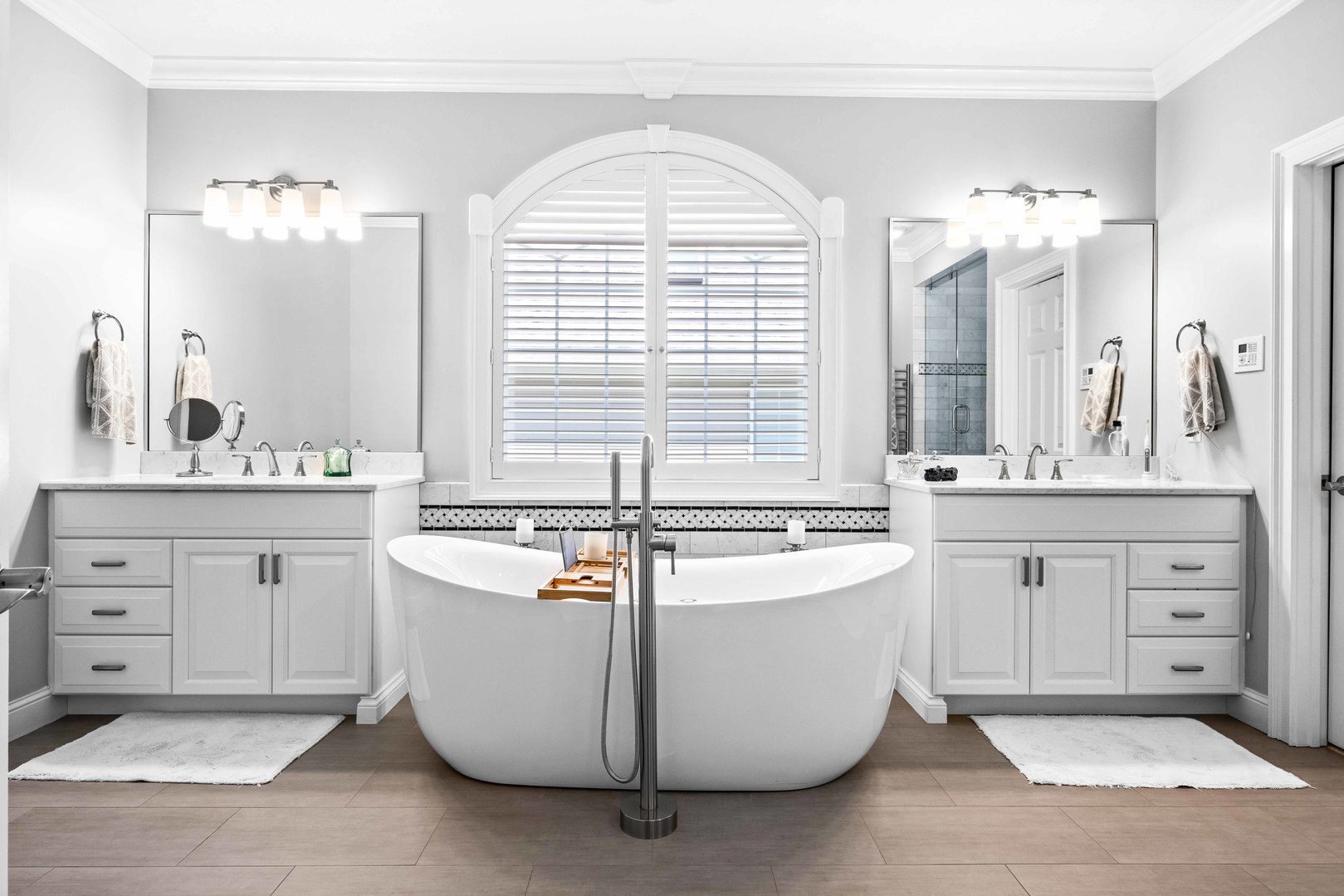 4 Derby Way Bloomington, IL 61704 - Photo 23 of 56 a spacious bathroom with double vanity a window a bathtub and double vanity