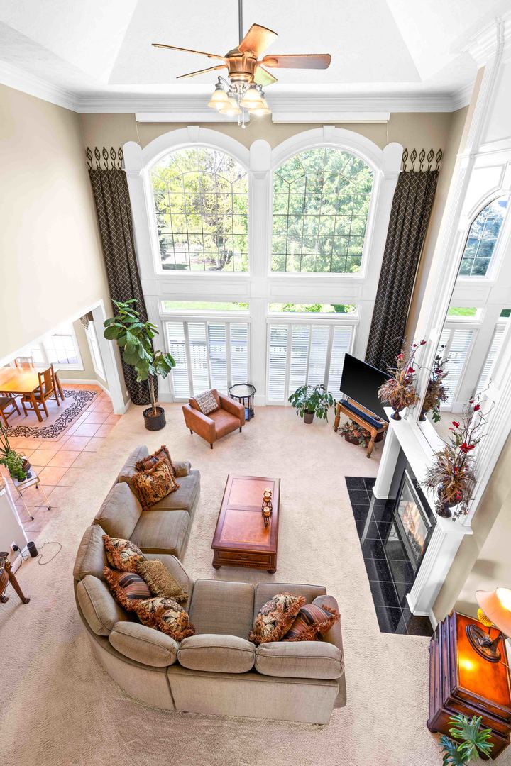 4 Derby Way Bloomington, IL 61704 - Photo 30 of 56 a outdoor living space with furniture and a flat screen tv