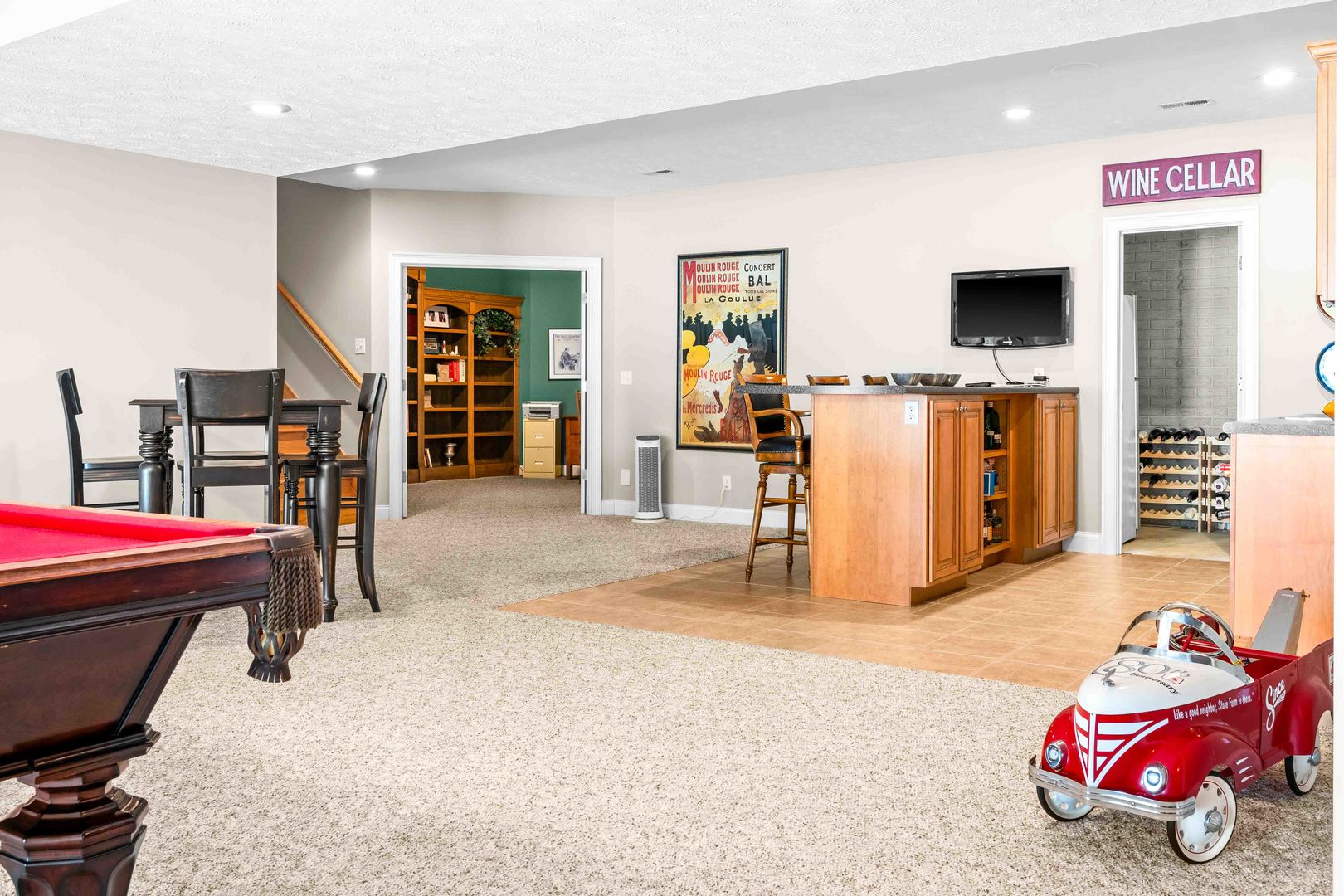 4 Derby Way Bloomington, IL 61704 - Photo 38 of 56 a living room with furniture and a flat screen tv