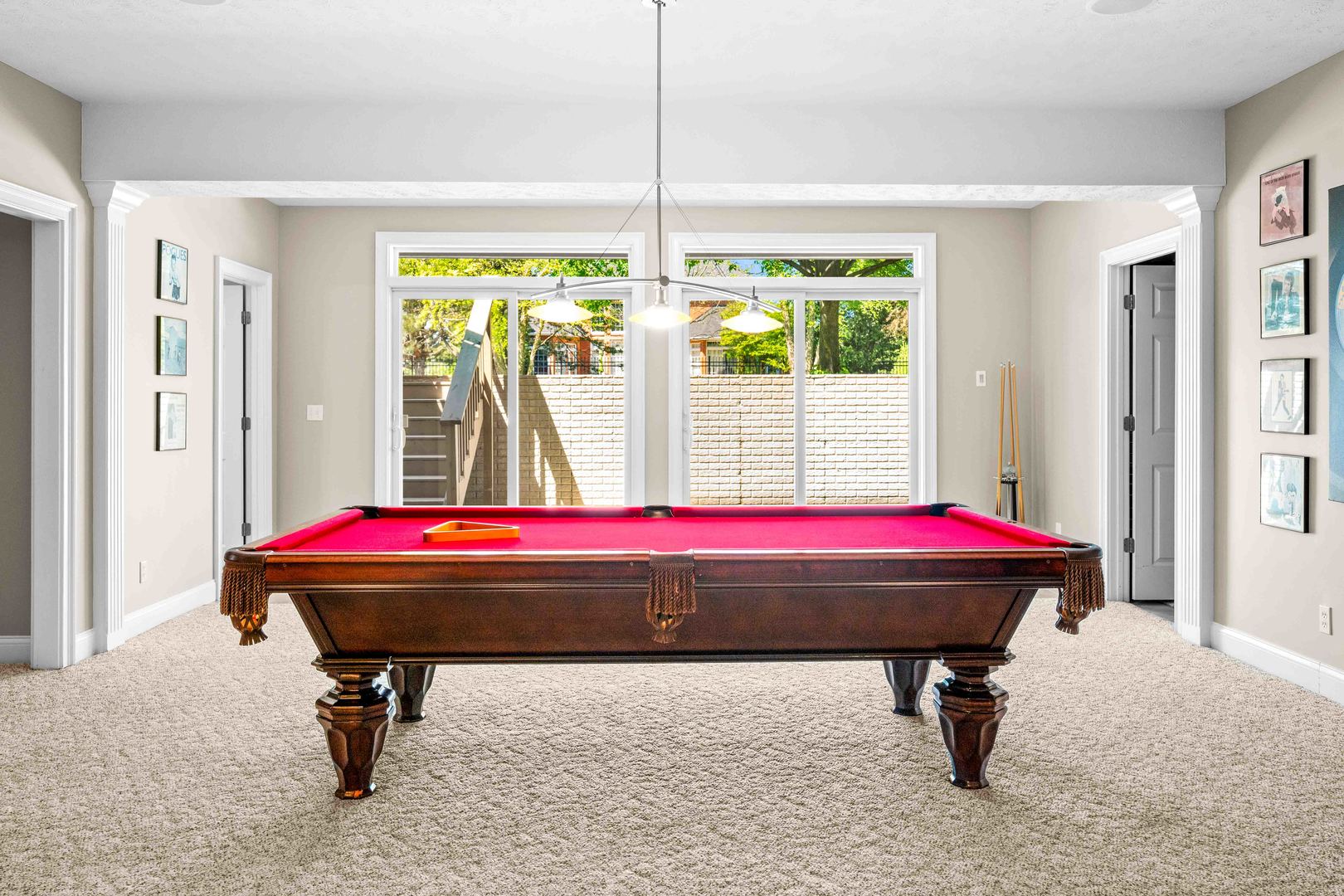 4 Derby Way Bloomington, IL 61704 - Photo 40 of 56 a living room with a table tennis table and a large window