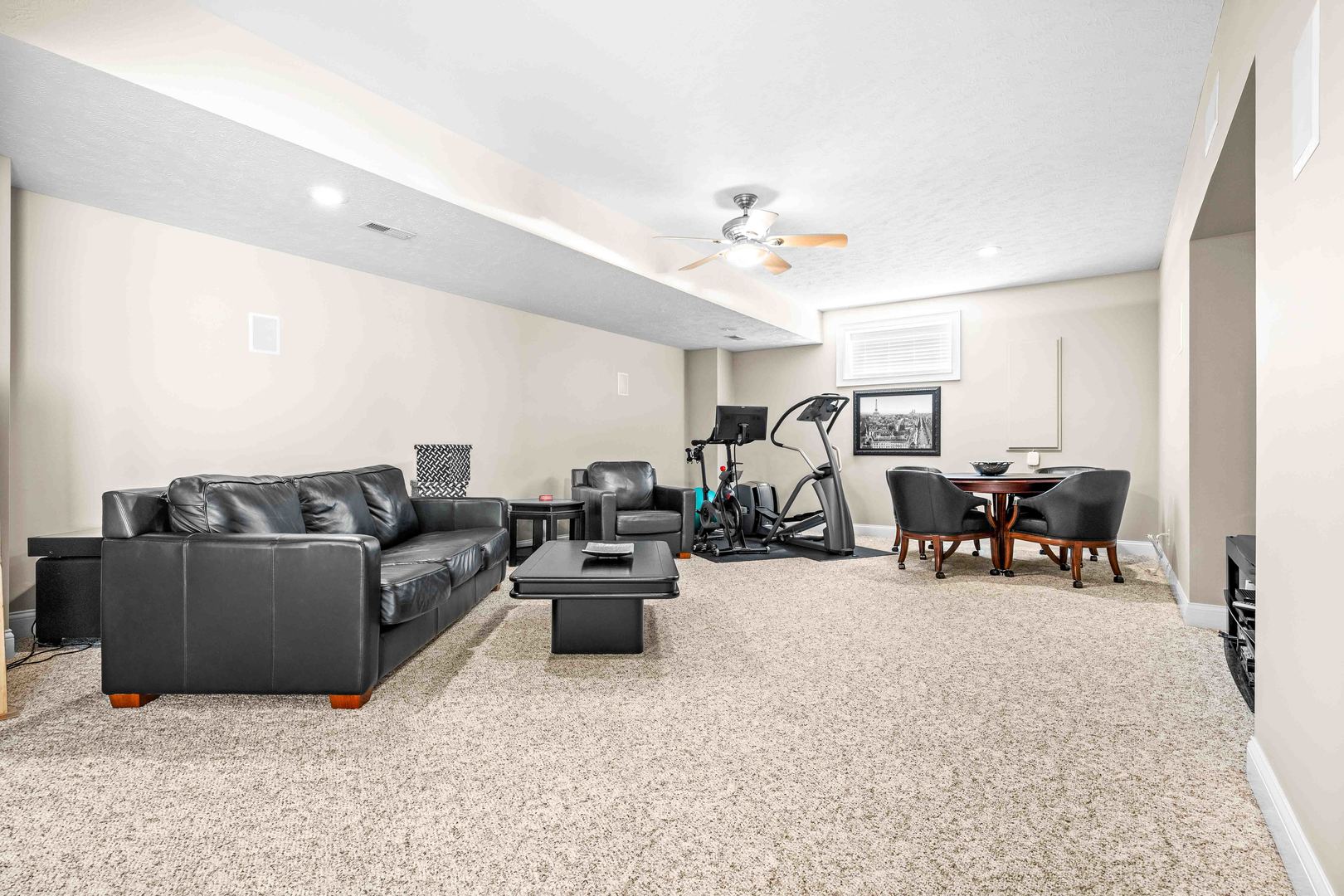 4 Derby Way Bloomington, IL 61704 - Photo 41 of 56 a living room with furniture and a chandelier