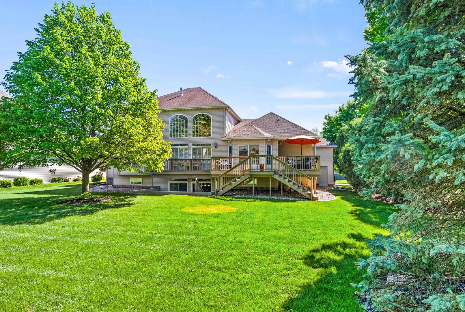4 Derby Way Bloomington, IL 61704 - Photo 48 of 56 a view of a house with a big yard plants and large trees
