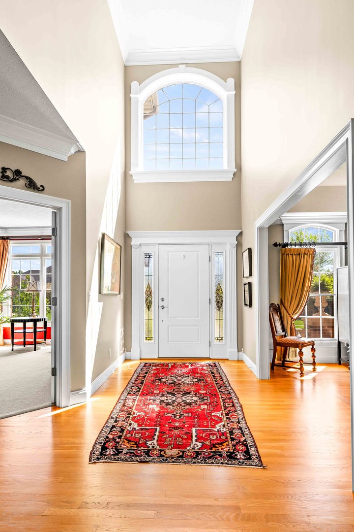 4 Derby Way Bloomington, IL 61704 - Photo 8 of 56 a living room with furniture rug and a large window
