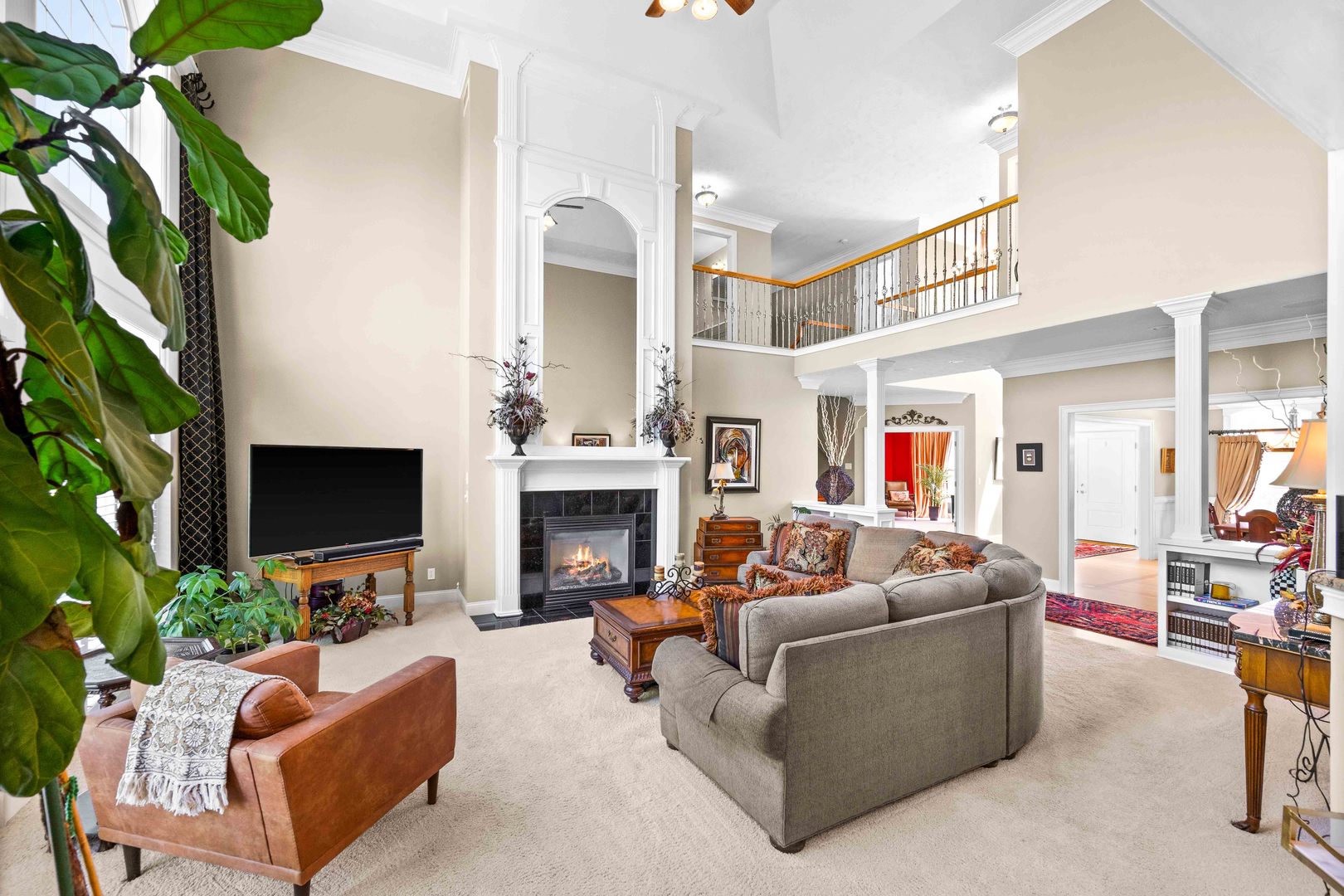 4 Derby Way Bloomington, IL 61704 - Photo 10 of 56 a living room with furniture potted plant and a fireplace