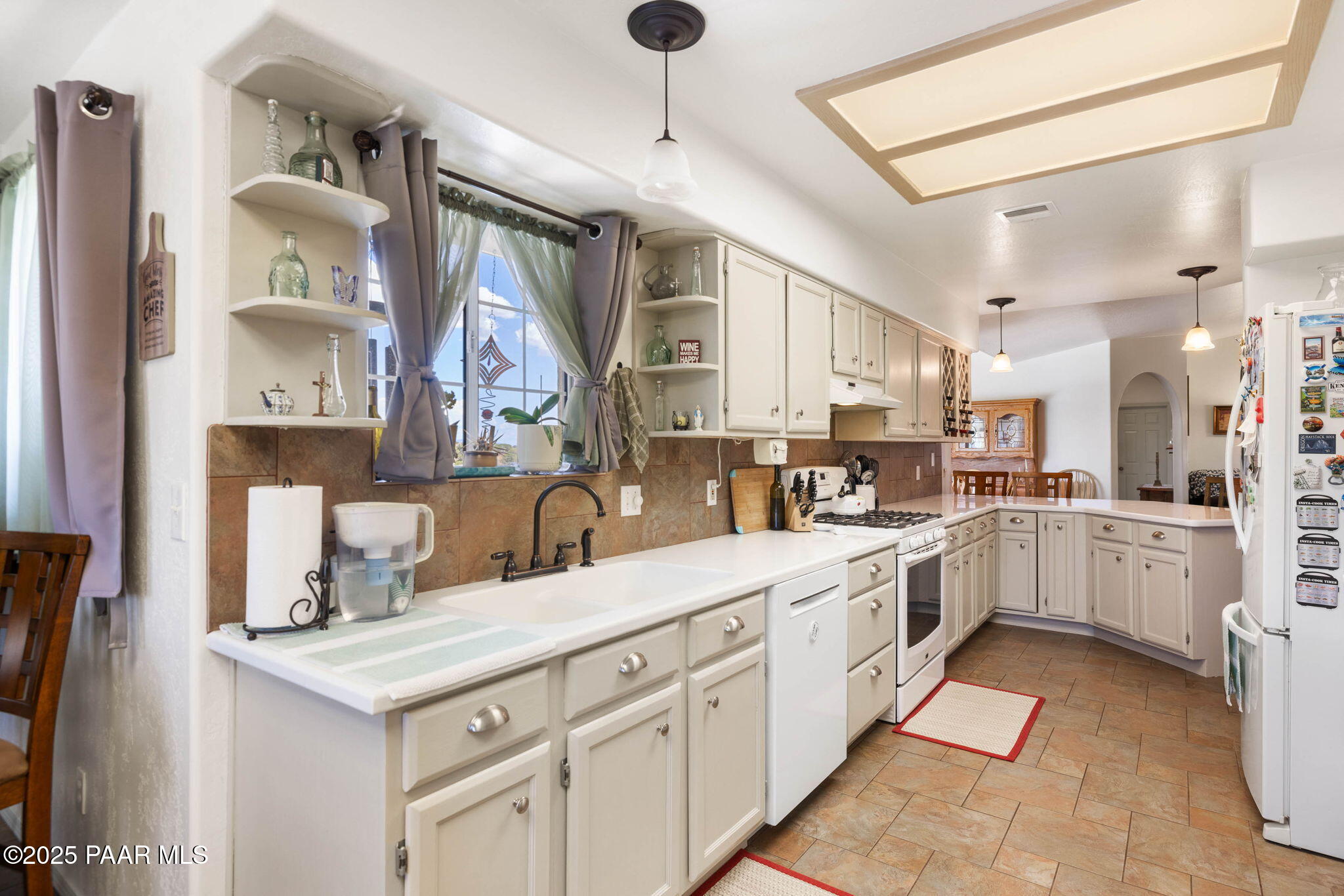 5400 North Skyhawk Road Chino Valley, AZ 86323 - Photo 11 of 26 a kitchen with a sink cabinets and window